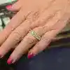 Diamond engagement ring with sparkling stones on a woman's finger.