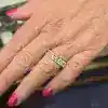 Diamond ring on a woman's finger, showcasing fine jewelry craftsmanship.