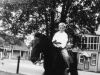 charles-johnson-in-front-yard-with-johnsons-store-on-left-and-gwaltneys-on-right-in-1938-img090