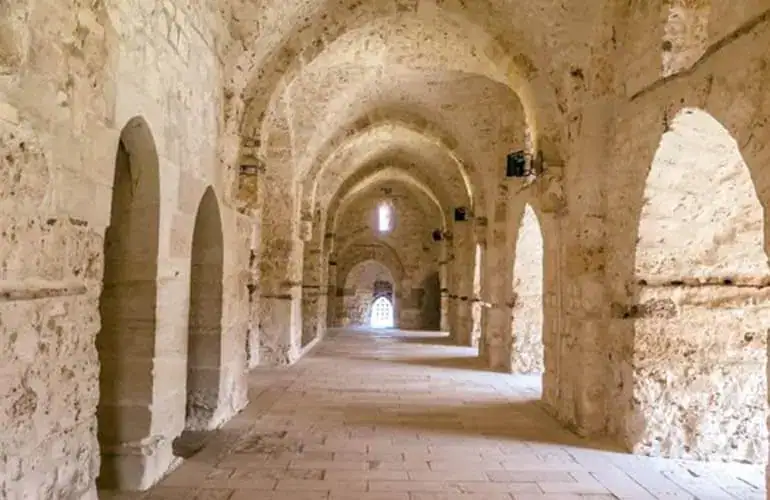 Stone corridor and vaulted interior inside Qaitbay fortress