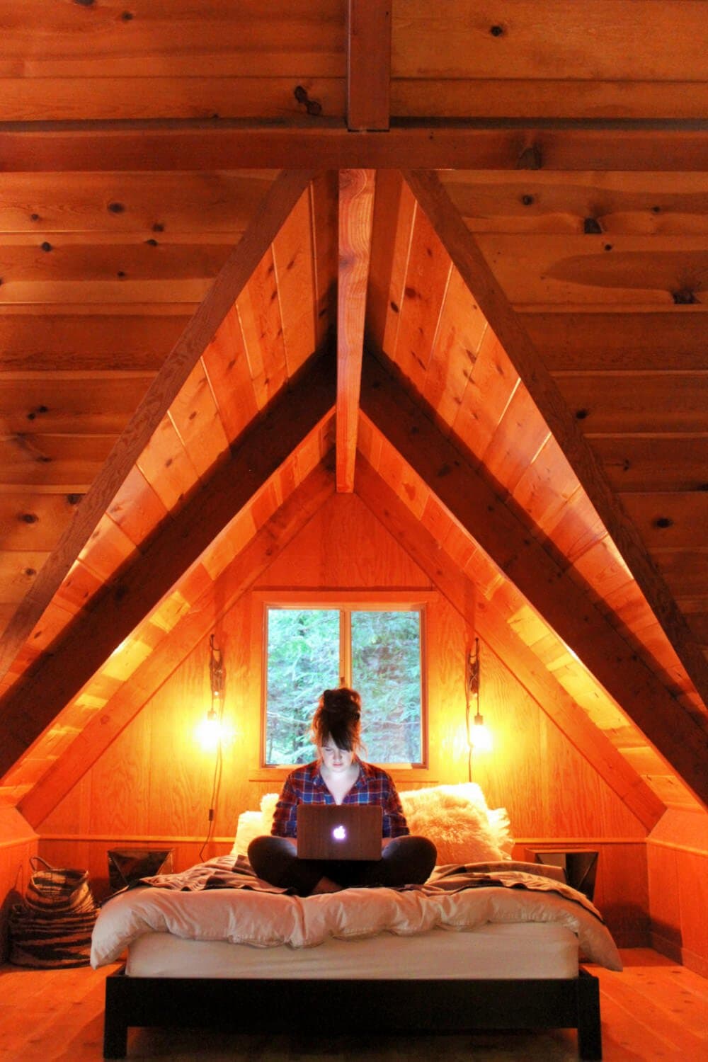 Working on the bed in our gorgeous cabin in Guerneville.