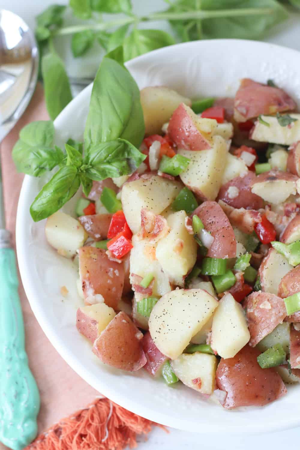 This flavorful Italian Potato salad is always a staple at any summer gathering I host. It's perfect for summer parties, potlucks or just as a simple side dish.....and it has bacon in it! Enough said!