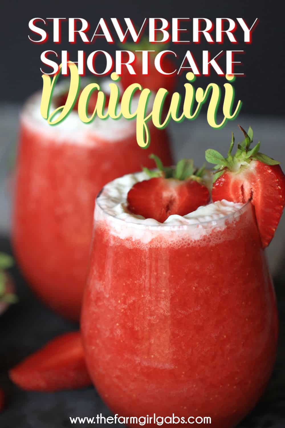 Cheers to Strawberry season. With just a few simple ingredients, you can make your own Strawberry Shortcake Daiquiris at home. Skip the mix and make fresh strawberry daiquiris at home using this easy recipe. It's the perfect slushy cocktail for cooling down in warmer weather! #strawberrydaiquiri #cocktails #slushie