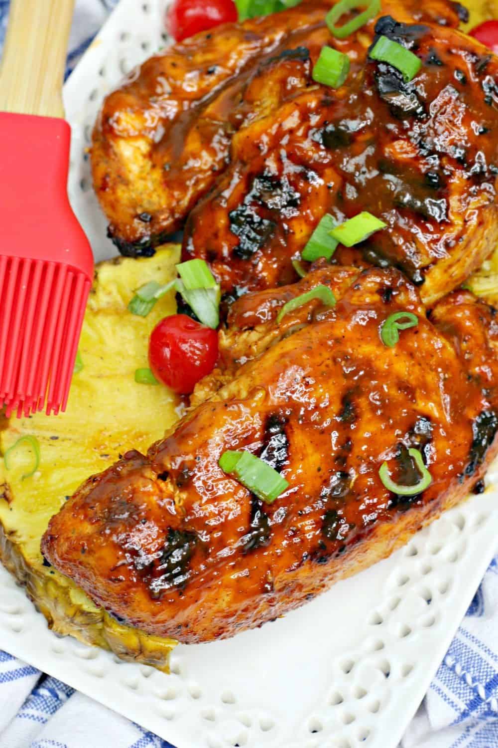 This flavorful Grilled Huli Huli Chicken recipe is delicious and simple. This Hawaiian-inspired chicken recipe is marinated and grilled to perfection. #grilledchicken #hulihulichicken #grillingrecipe #hawaiianchicken