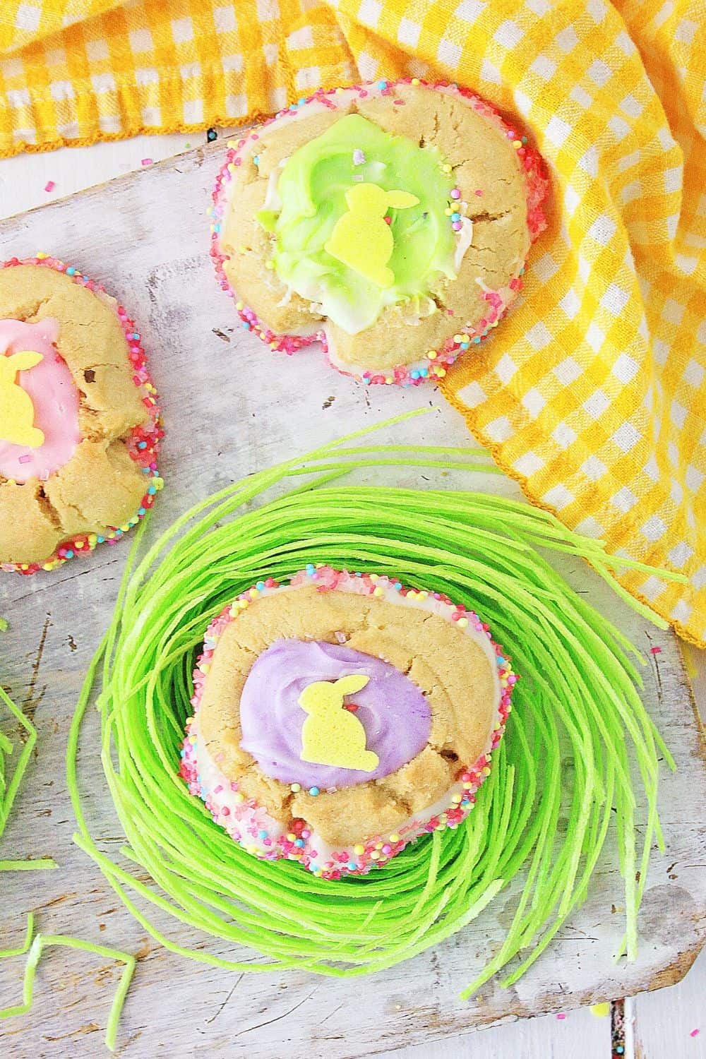 These homemade Easter Thumbprint Cookies are a sure sign of spring. Bake a batch of these easy colorful holiday cookies to share today. Everyone love thumbprint cookies!