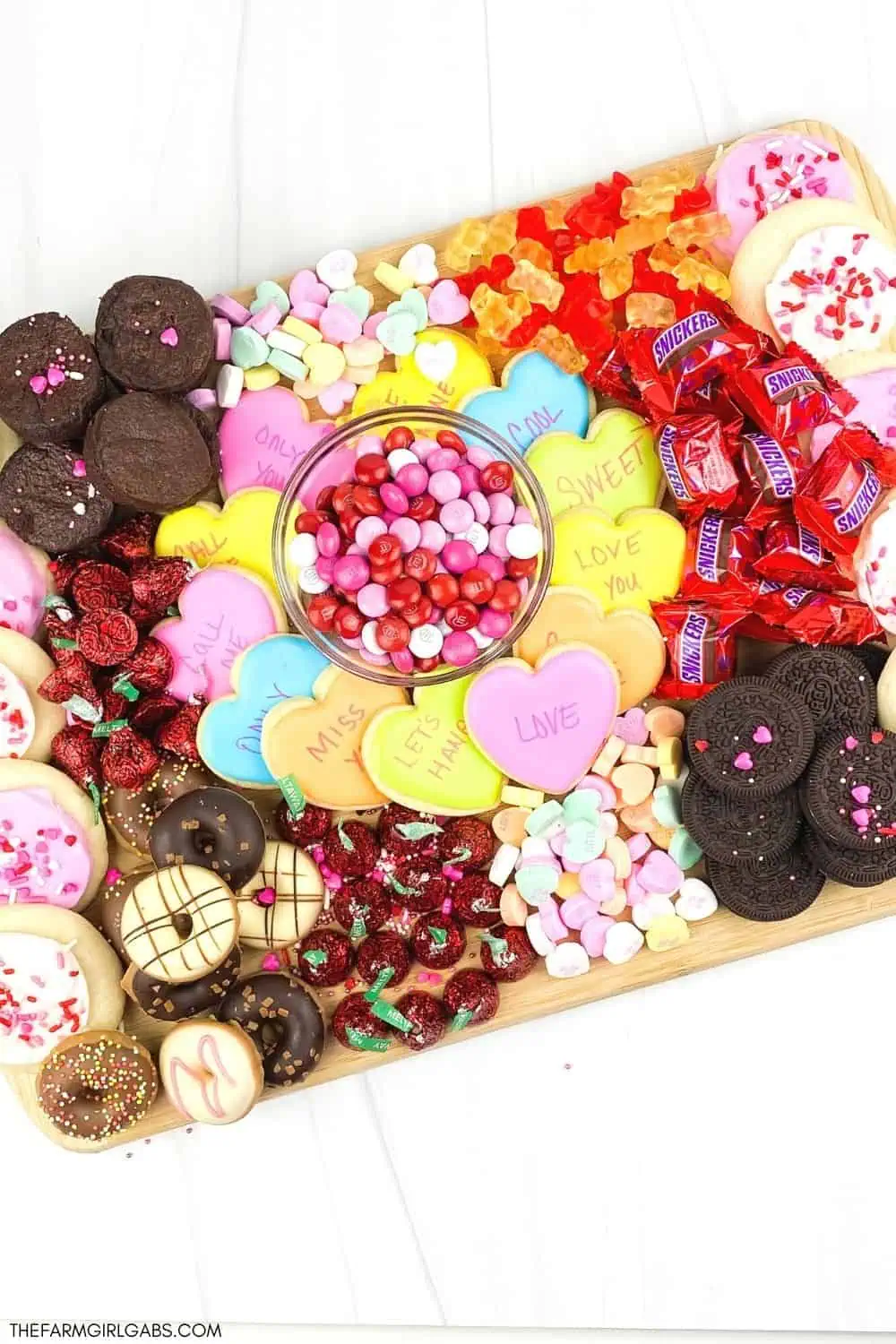 Kids and adults will love eating this Valentine's Day Dessert Board. Find out how to make an easy dessert board for Valentine's day filled with candy and treats. This Valentine’s Day charcuterie board is great to make for a party or tailor to any special holiday. Learn how to make a charcuterie board for your next party or gathering. Kids and adults will enjoy this easy dessert board filled with your favorite candies and sweet treats. Read more to find out how to make a holiday dessert board.