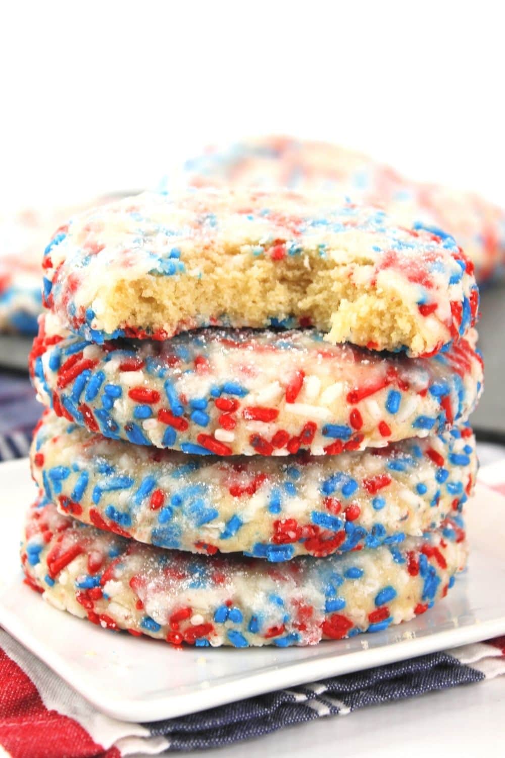 There is no better way to celebrate a day like July 4th than with some homemade red, white, and blue Patriotic Butter Cookies. Try this recipe for some of the tastiest, most flavorful baked cookies ever! This easy red, white and blue recipe is a delicious 4th of July Recipe. This classic butter cookie recipe is rolled in red, white and blue patriotic sprinkles.