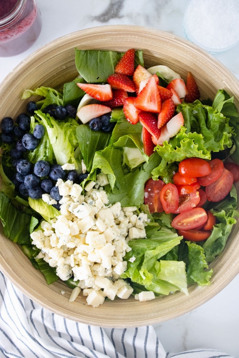 Prepare a fresh and festive salad for the 4th of July with this easy recipe for Red, White & Blueberry Salad. This patriotic recipe is full of flavor and naturally good for you, making it the perfect summer salad recipe