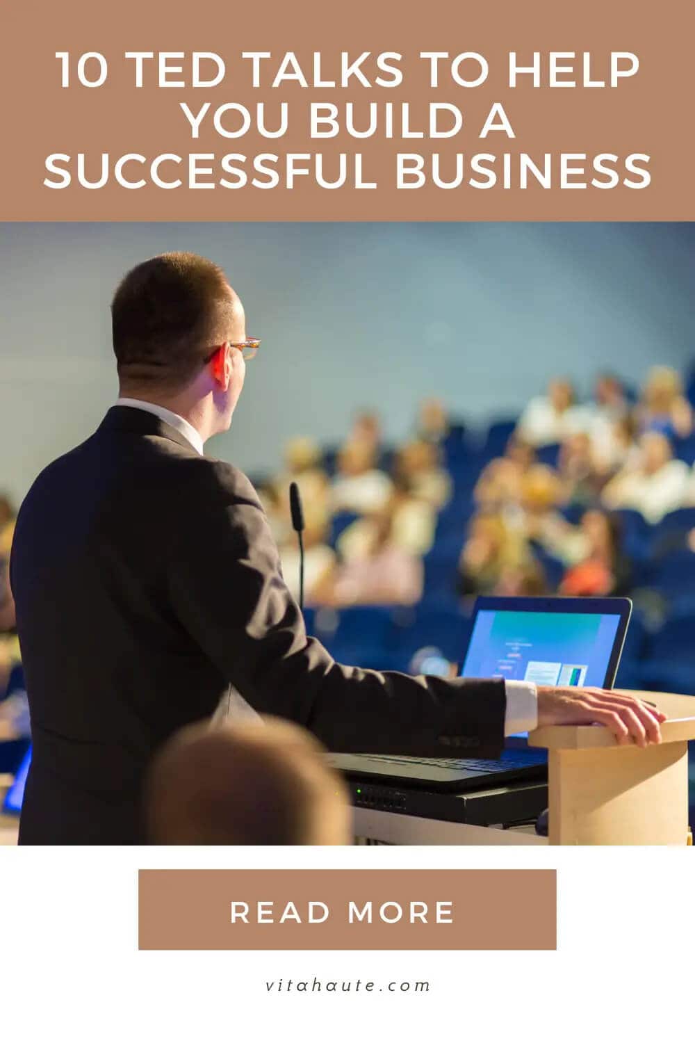 A motivational speaker in front of his audience of aspiring entrepreneurs