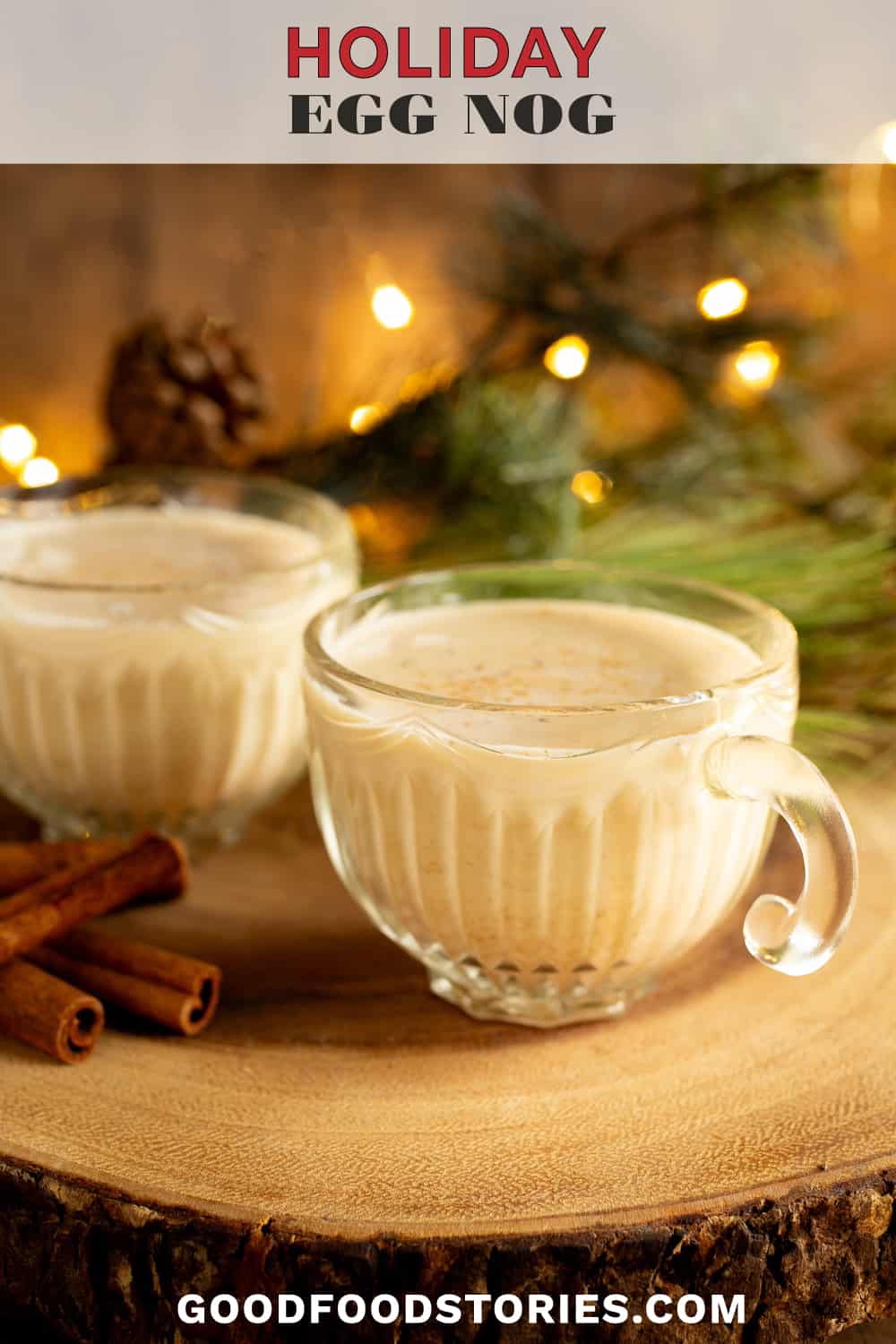 glasses of egg nog surrounded by holiday greenery and lights