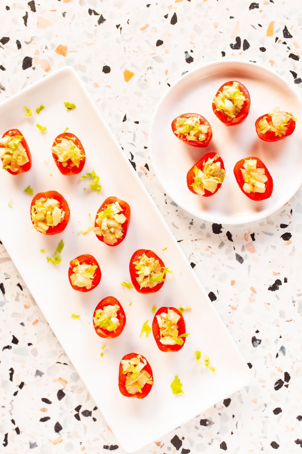 appetizer plates of Bloody Mary tomatoes stuffed with celery