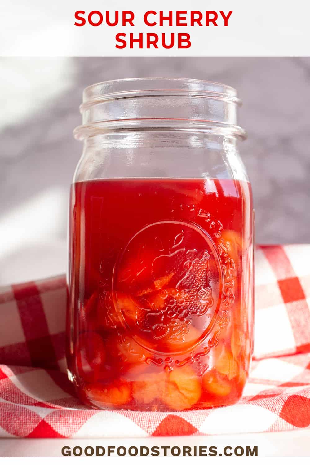 mason jar filled with sour cherry shrub