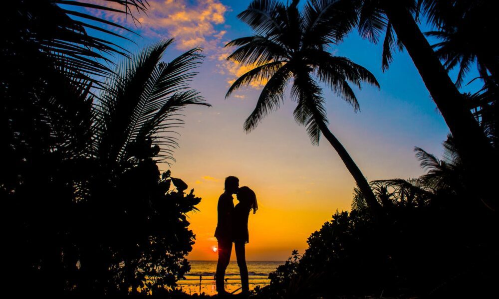 silhouette of man and woman kissing Free Honeymoon
