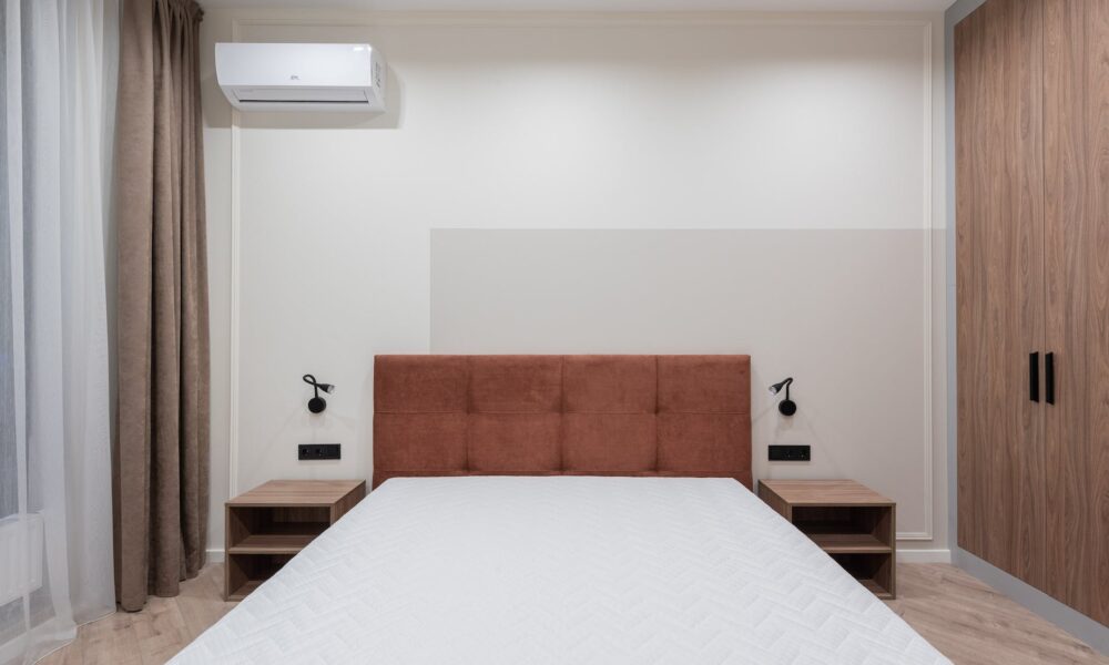 interior of bedroom with big bed and wardrobe