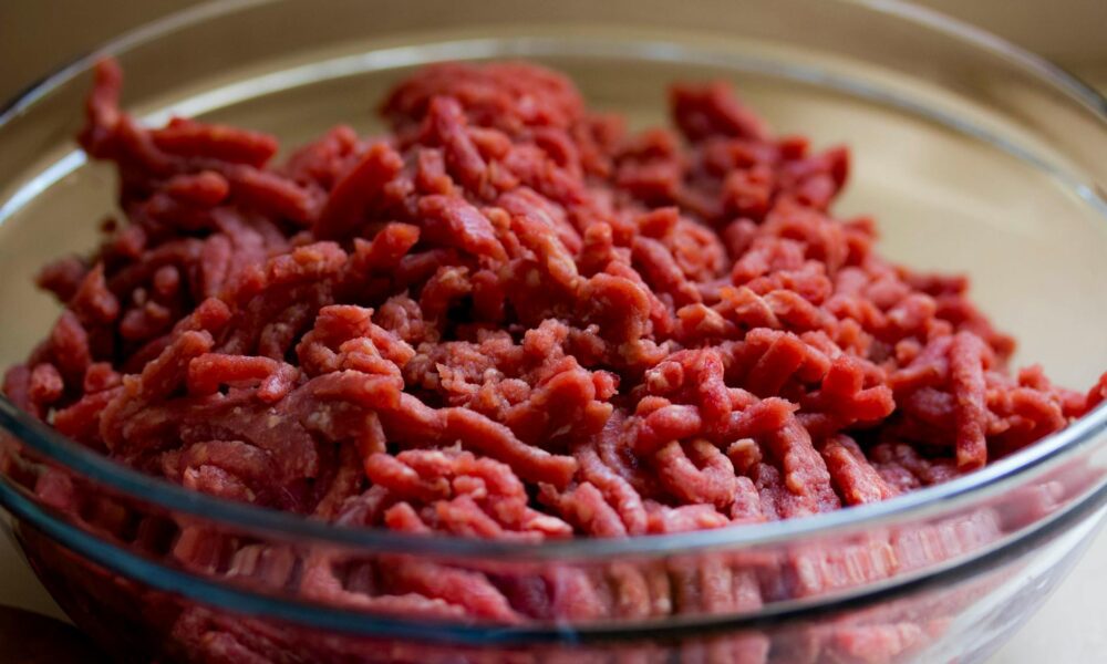 "E. coli-contaminated ground beef packaged on March 28, 2024, with a 'Use/Freeze by' date of April 22, 2024." grind meat in glass bowl