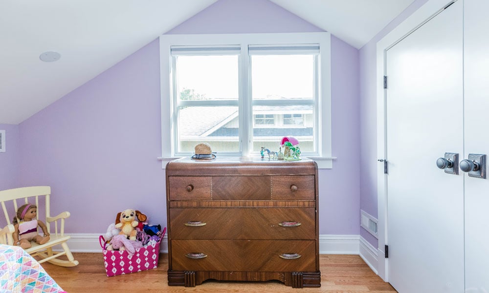 bedroom with vaulted ceilings and pink walls