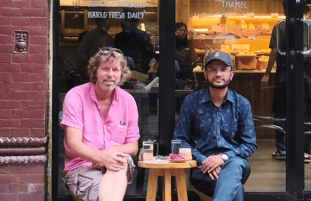Menno and Santosh in front of Pumpernickel Bakery in Thamel in the Heart of Kathmandu.