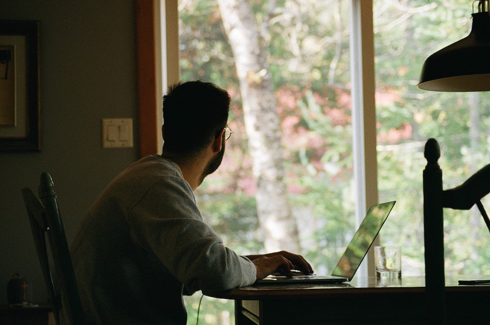  A man staring out the window.