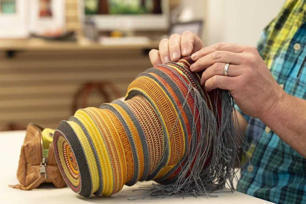 Man weaving basket