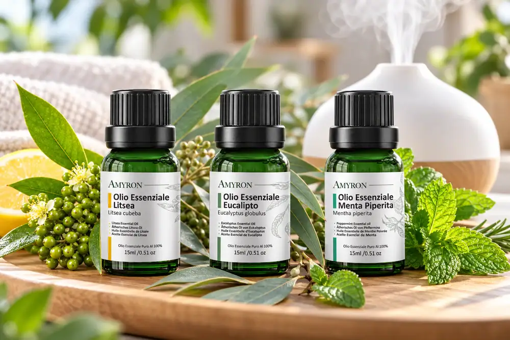 Oli essenziali AMYRON per respirare meglio con eucalipto globulus, menta piperita e litsea accanto a un diffusore