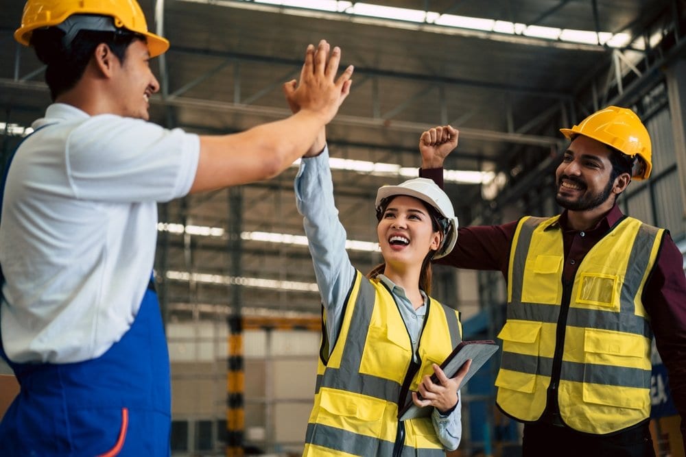 Warehouse Workers High Five