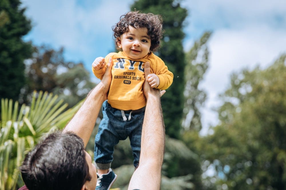 son enjoying time with his dad on his photoshoot