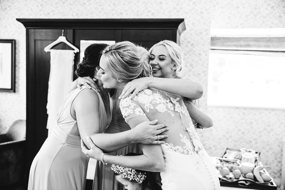 hug from bridesmaids