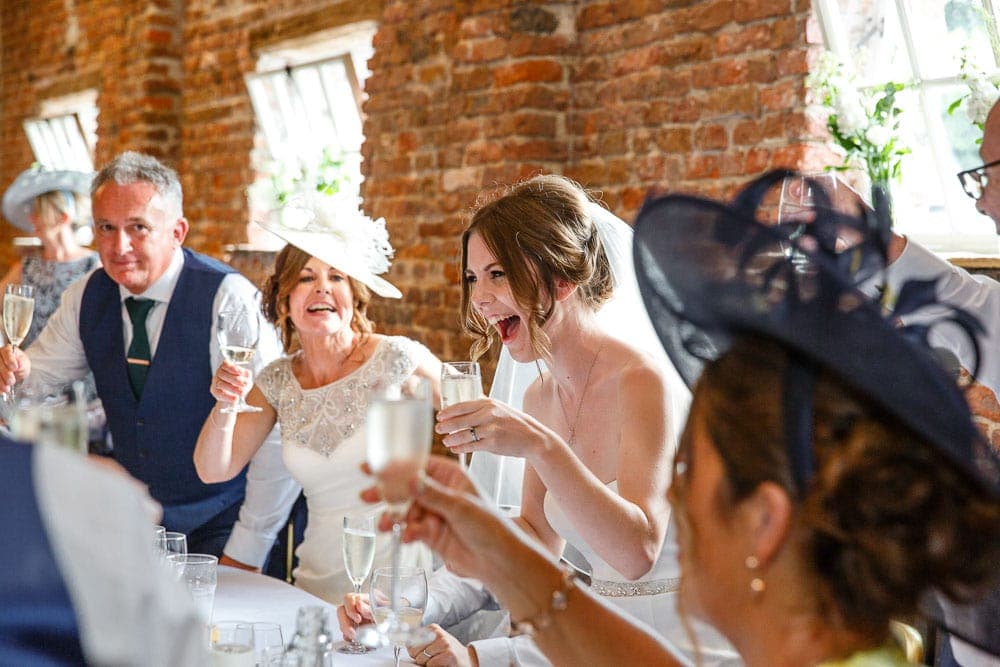 bride laughing at speeches
