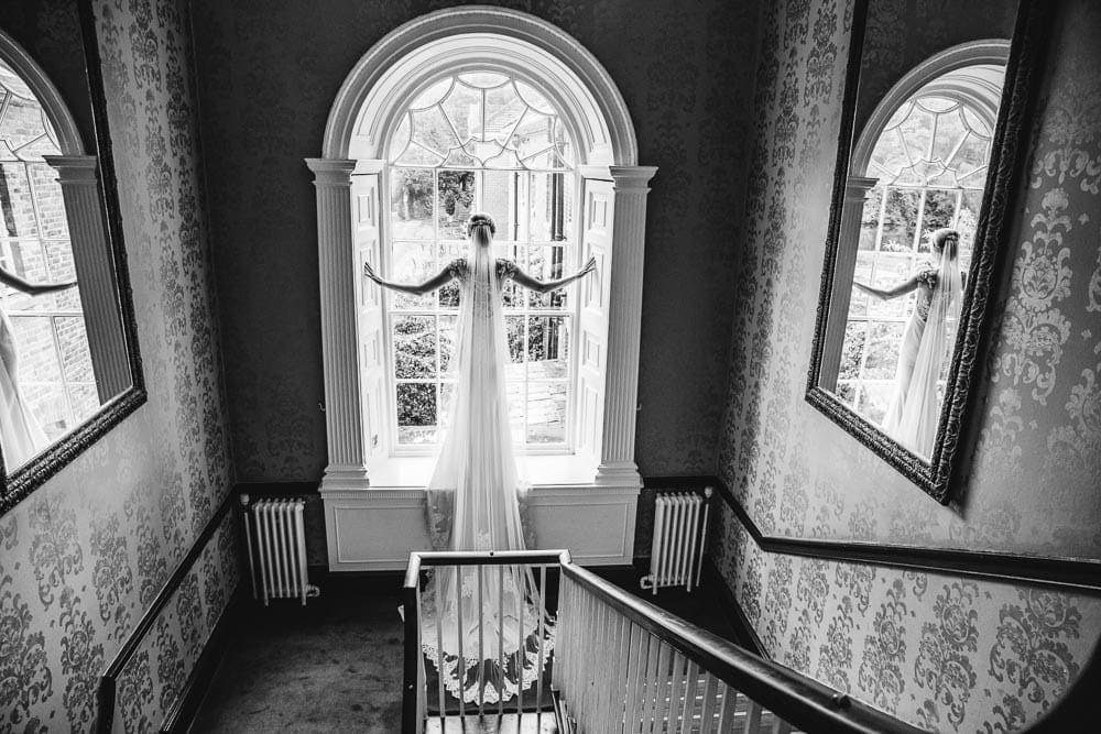 bride in the window at mottram hall