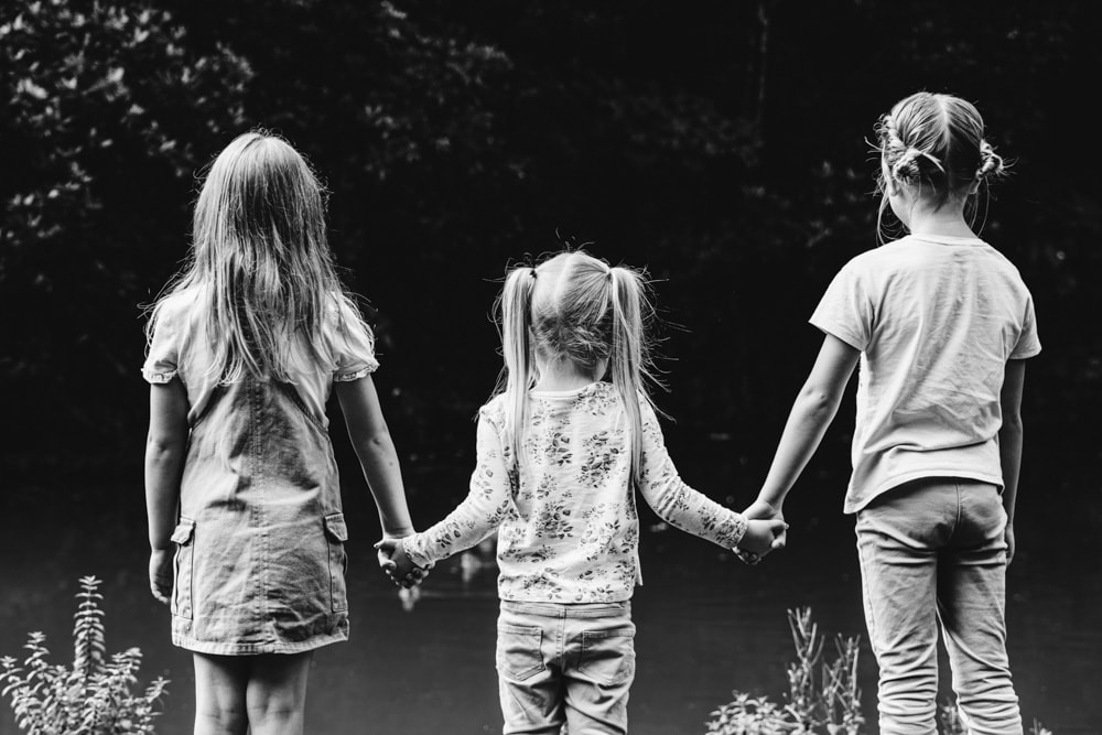 kids holding hands near the bridgewater canal in worsley