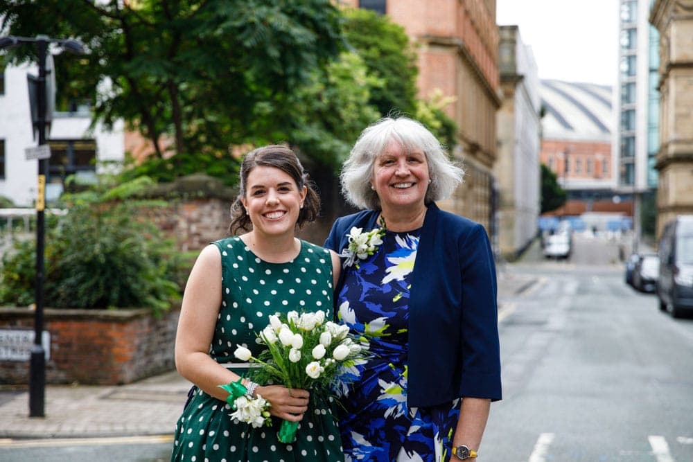 bride and mum outside Heron House Registry Office