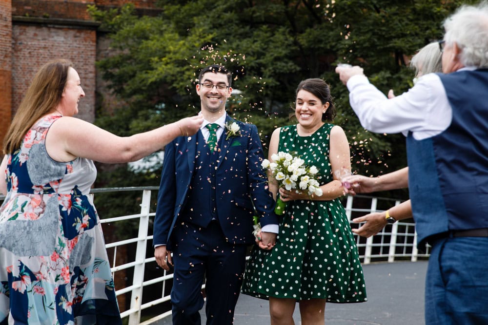 confetti with bride and grooms family in castlefield manchester
