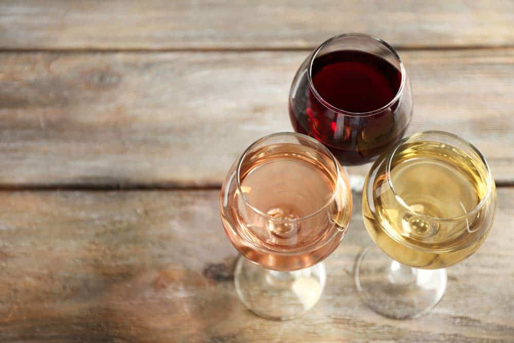 Mama Linc Glasses of Red, White and Rose Wine on a Table