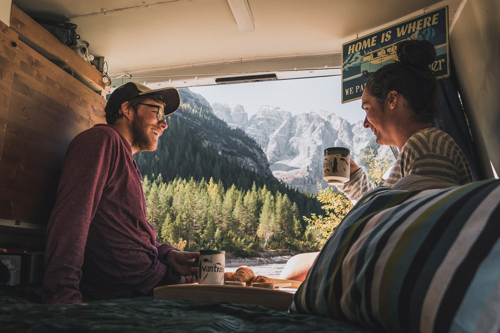 couple enjoying tea in their van, vanlife apps, arboursabroad, vantrails
