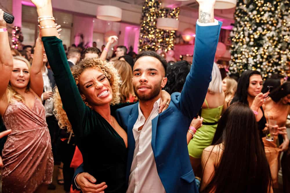 people having fun with hands in the air at a party in manchester taken by er event photography