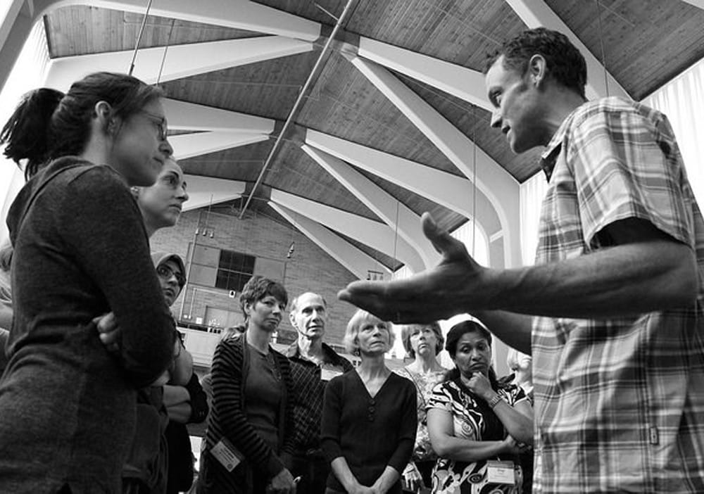 FAM Faculty member Dr. John Bagnulo answers one-on-one questions with FAM trainees at Kripalu.