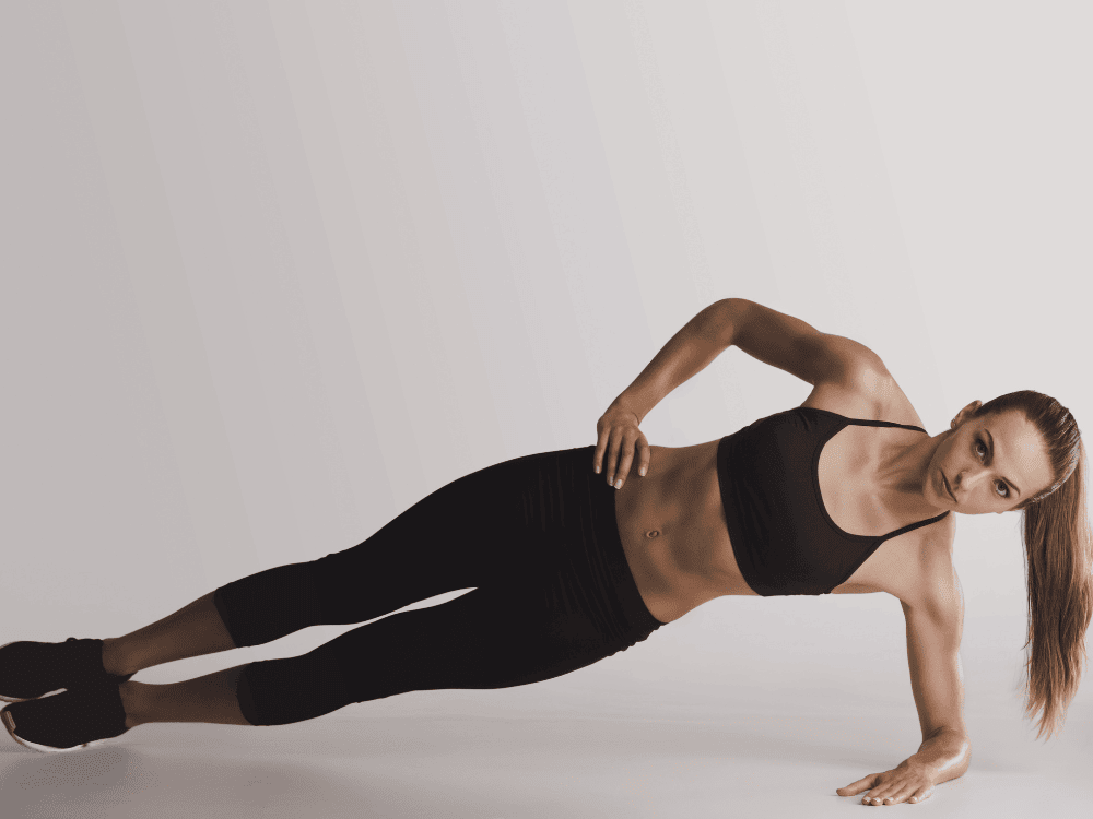 Client performing a side plank during corrective exercise training - Body360 Fit Los Angeles