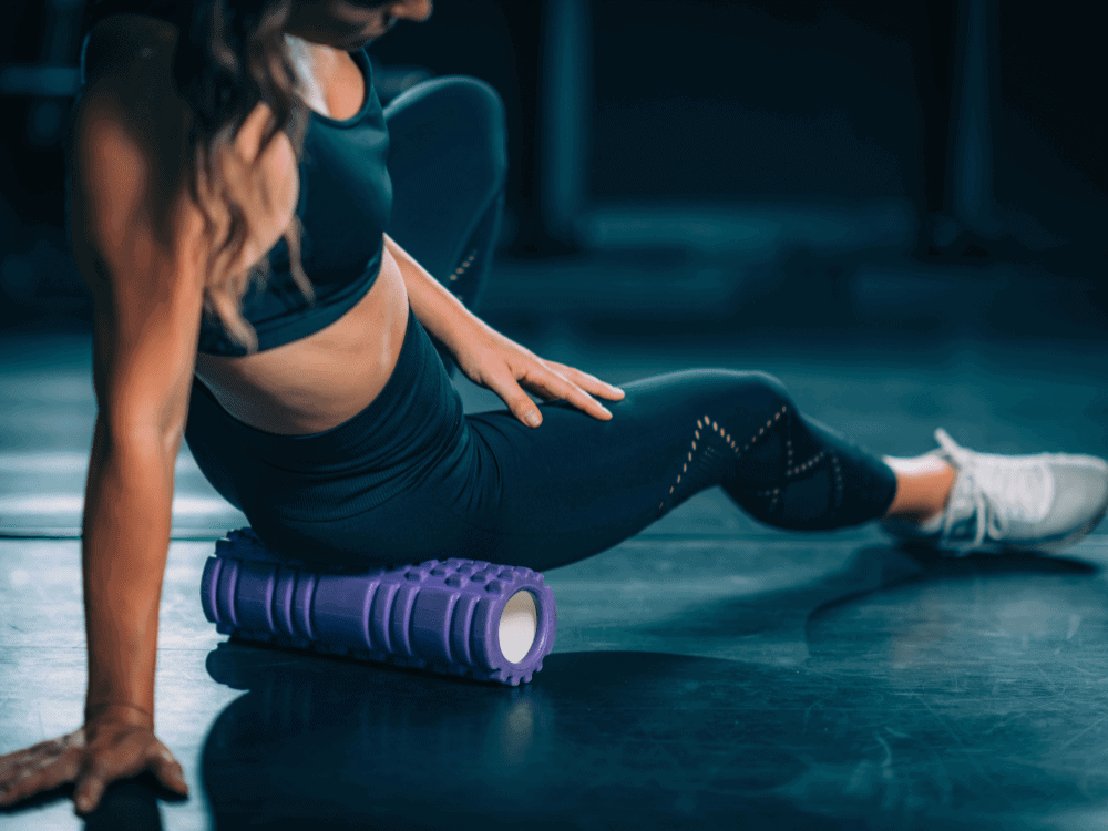 Client performs foam rolling drills during a low back training program - Body360 Fit Los Angeles
