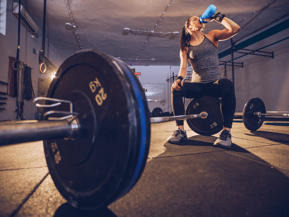 Client resting between barbell deadlifts during a natural bodybuilding program - Body360 Fit Los Angeles