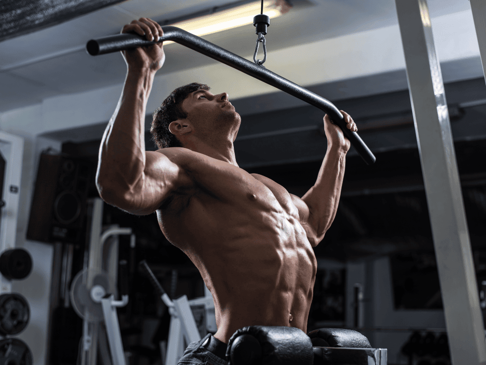 Client performs a t-bar pulldown during a natural bodybuilding routine - Body360 Fit Los Angeles 