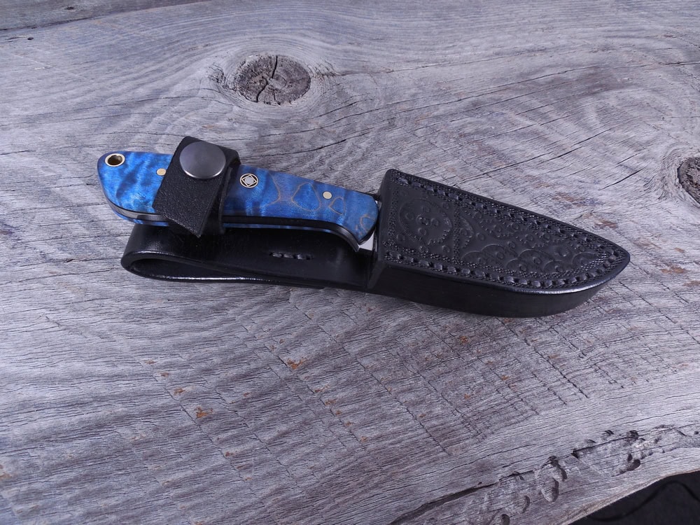 H14 Electric Blue Flame Maple EDC inserted into handmade black leather sheath