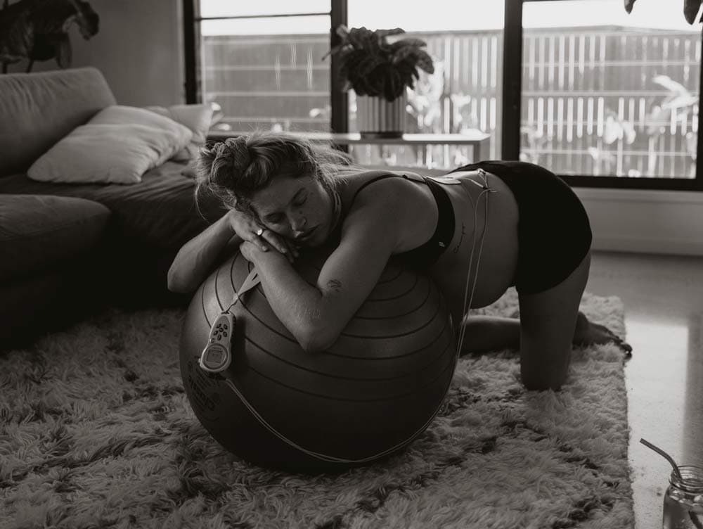 Mama Linc Pregnant Woman in Labour Using an Exercise Ball and Tens Machine