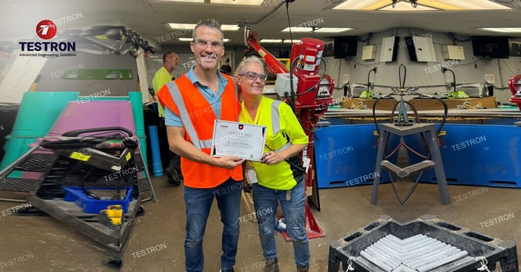 Testron Technician Handing over training certificate for TT-UL6 Falling Weight Impact Tester