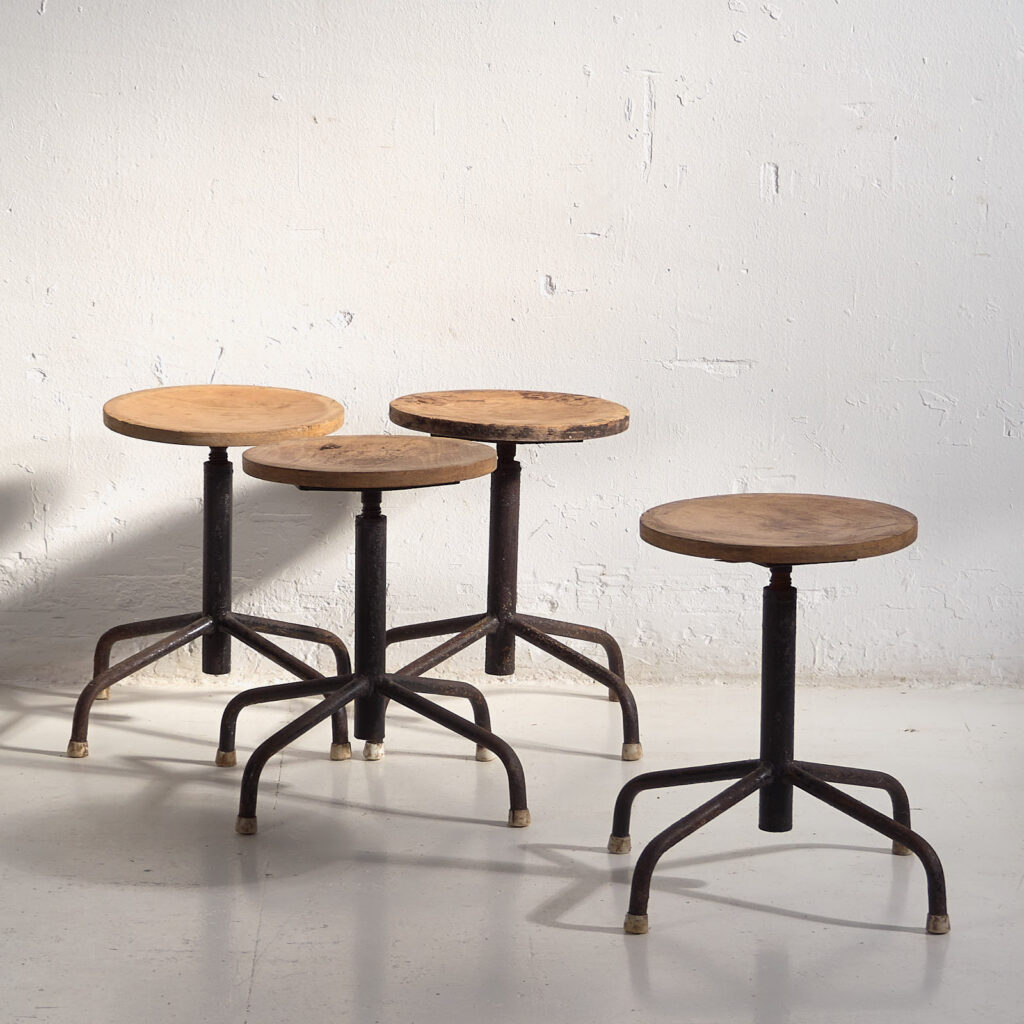 Industrial style round stools (c.1950). Set of 4 pieces