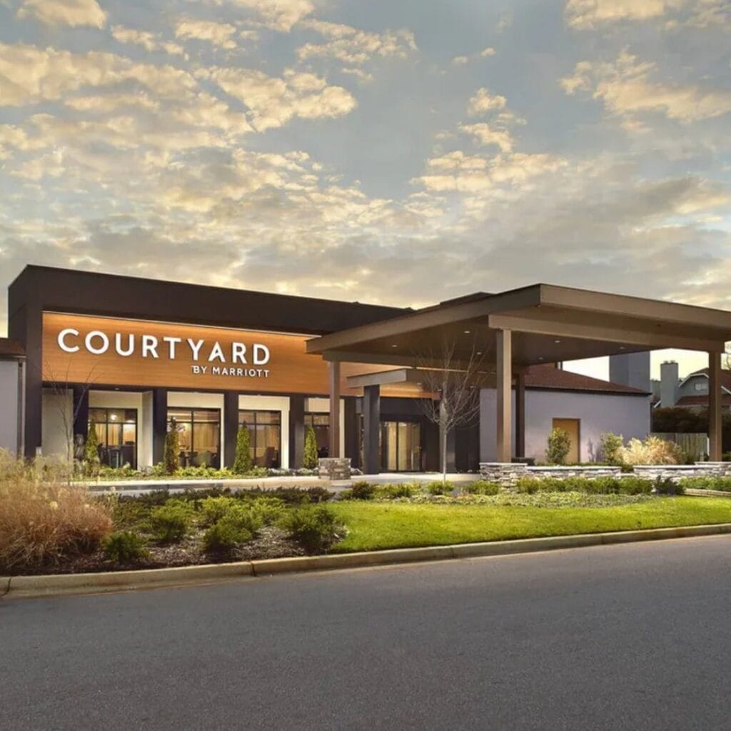 Exterior of a Courtyard by Marriott hotel, beautifully landscaped following a hospitality renovation