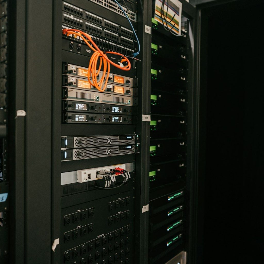 a rack of servers in a server room