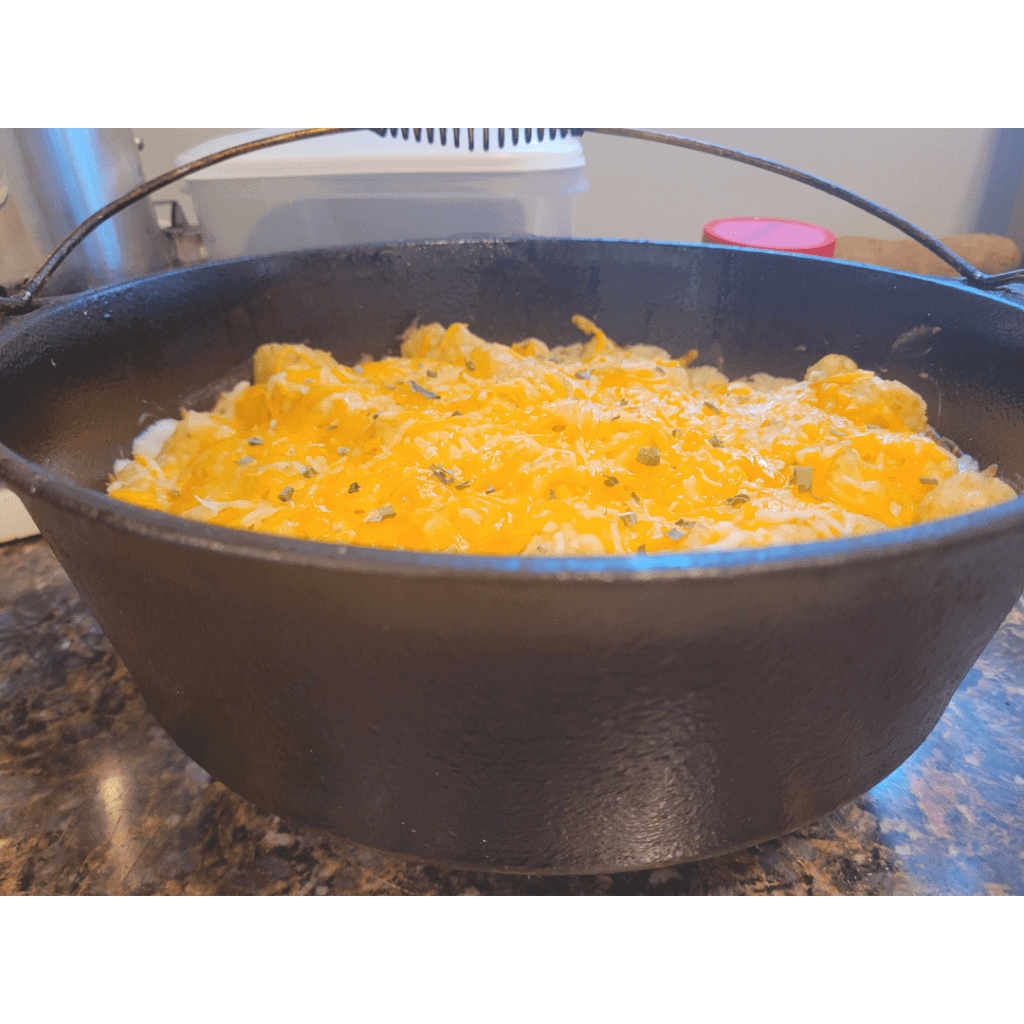 Image illustrates tater tot casserole in a Dutch oven.