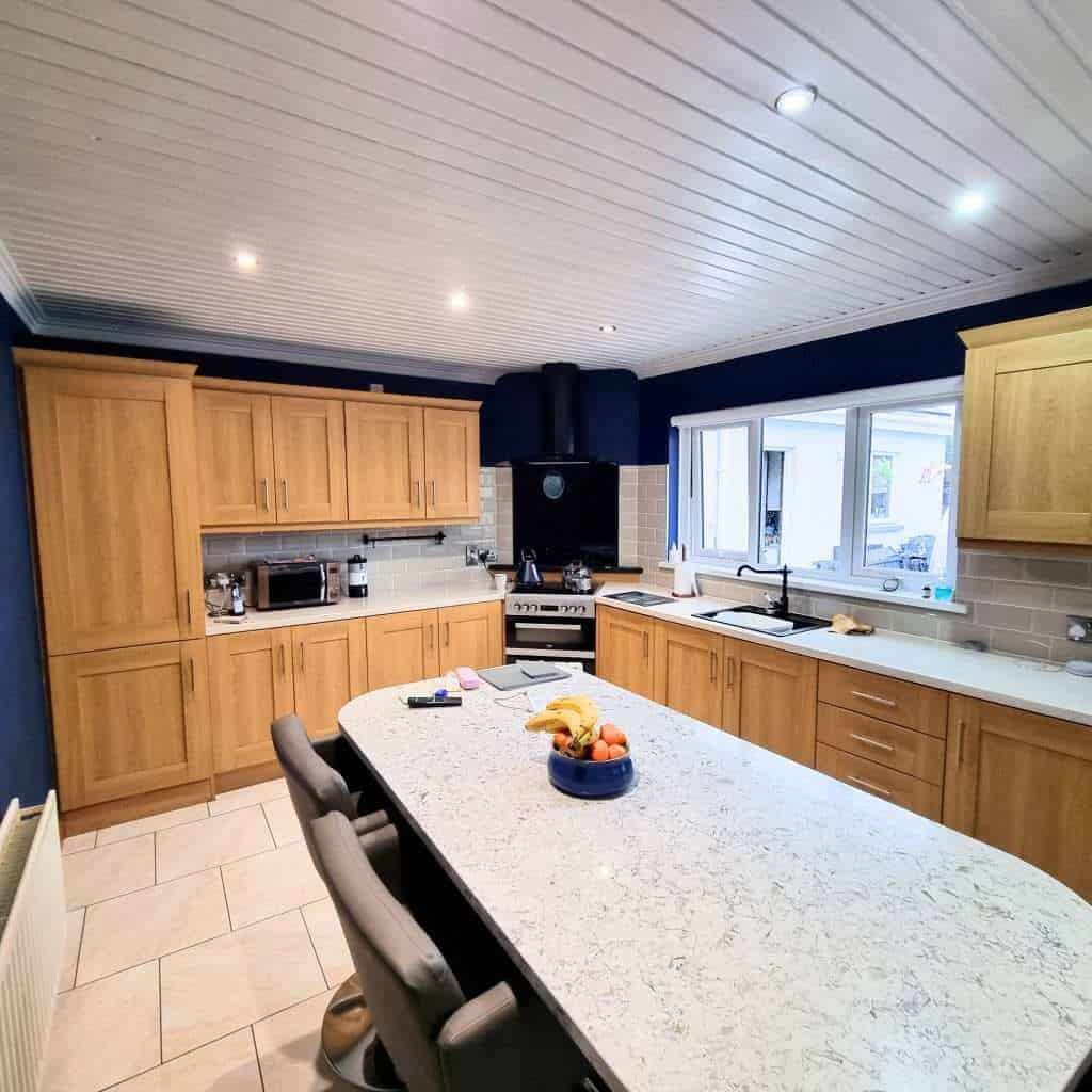 Modern kitchen with wooden cabinets and island.