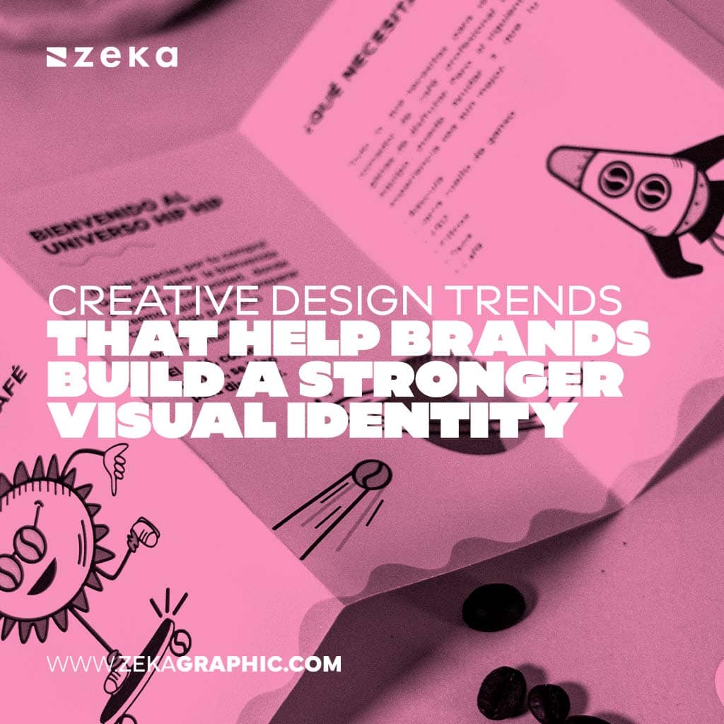 Pink duotone image of printed branding materials with playful illustrations, including a sun character and a rocket, featuring bold white text reading Creative Design Trends That Help Brands Build a Stronger Visual Identity.