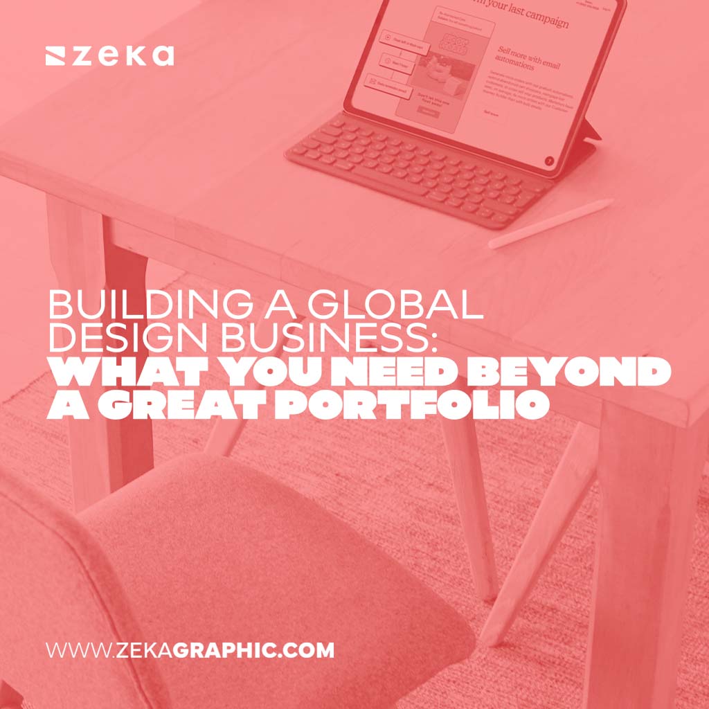 Square pink-tinted photo of a tablet with a keyboard on a desk displaying a marketing dashboard, with bold text reading "Building a Global Design Business: What You Need Beyond a Great Portfolio".